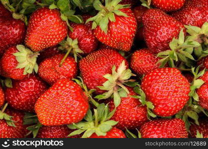 Strawberry berries close up as a background