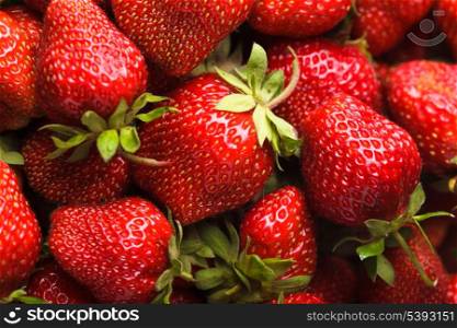 Strawberry berries close up as a background