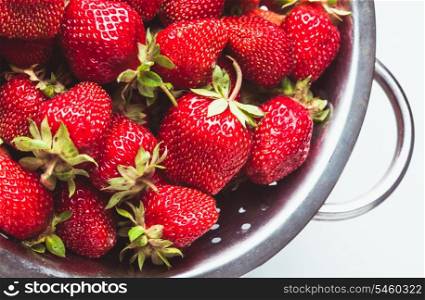 Strawberry berries close up as in a colander