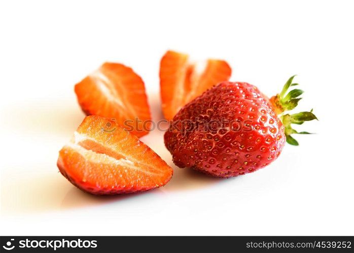 strawberry berry and strawberry slices on a white background