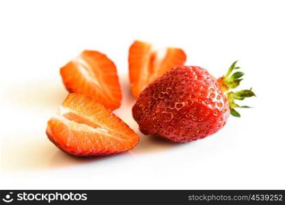 strawberry berry and strawberry slices on a white background