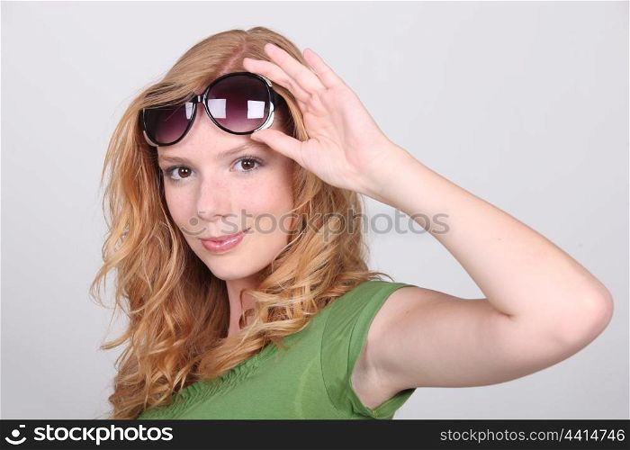 Strawberry blonde with big sunglasses