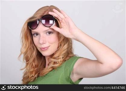 Strawberry blonde with big sunglasses