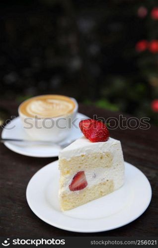 Strawberry cake on wood
