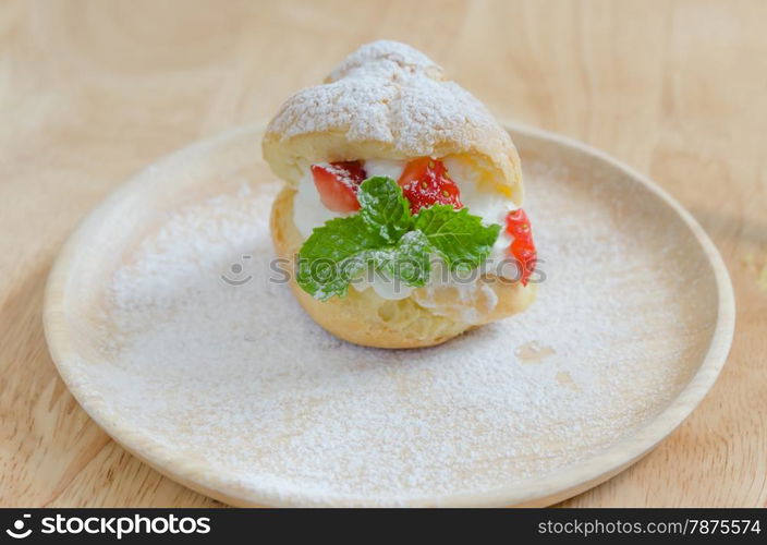 strawberry Choux Cream. fresh strawberry Choux Cream on wooden dish