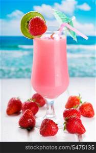 strawberry cocktail on a beach