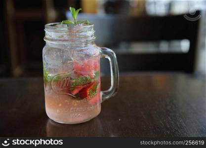 strawberry cocktail on wood background