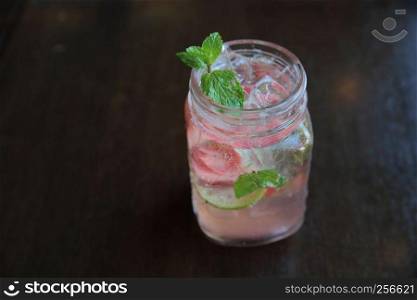 strawberry cocktail on wood background