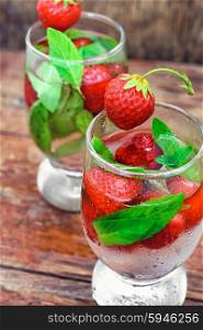 Strawberry cocktail with ice. Two glass with glass of a cool drink of strawberries and mint.