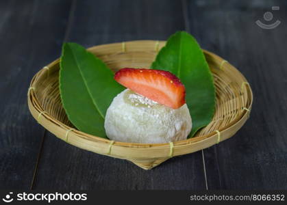 Strawberry Daifuku Mochi Japanese dessert on bamboo basket , still life