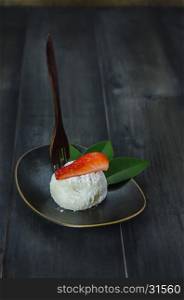 Strawberry Daifuku Mochi Japanese dessert on dish over wooden background , still life