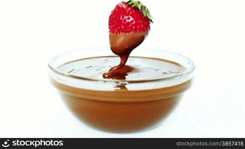 Strawberry dipped in chocolate in glass bowl