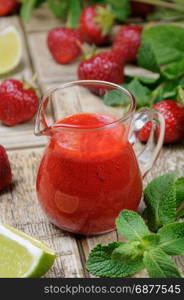 Strawberry fresh sauce with mint and lime. Vertical shot.