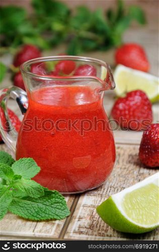 Strawberry fresh sauce with mint and lime. Vertical shot.