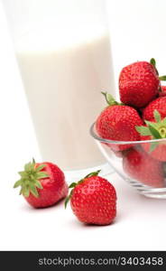 Strawberry. Fresh strawberries and a glass of milk on a white background