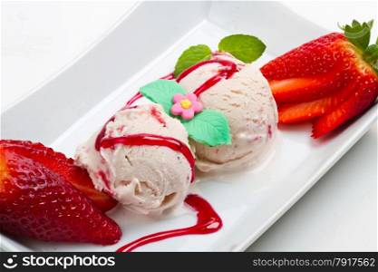 Strawberry ice cream with fruits close up