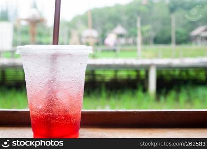 Strawberry Italian soda with ice, Summer drink, Close up with nature in background