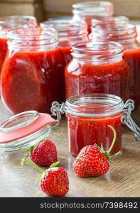 Strawberry jam cooking finished jam in jars.. Strawberry jam cooking finished jam in jars