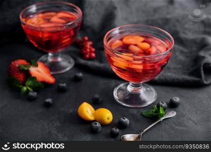 Strawberry jelly with fresh berries and peppermint