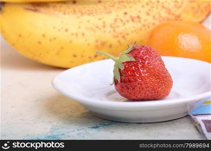 strawberry, mandarin, orange, banana, many different fruits for the health of the entire family
