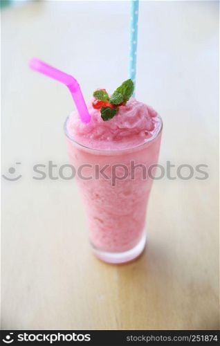 strawberry milk shake on wood background