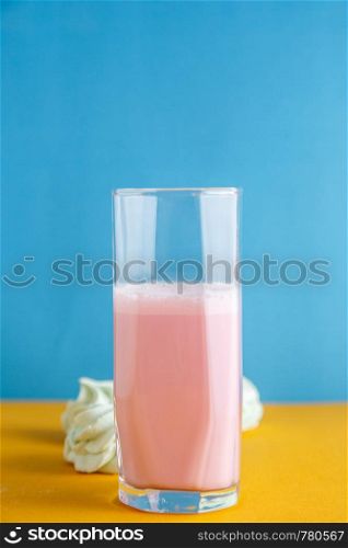 strawberry milkshake on a colored background