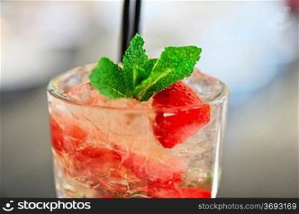 Strawberry mohito cocktail with ice and mint