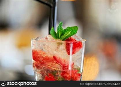Strawberry mohito cocktail with ice and mint