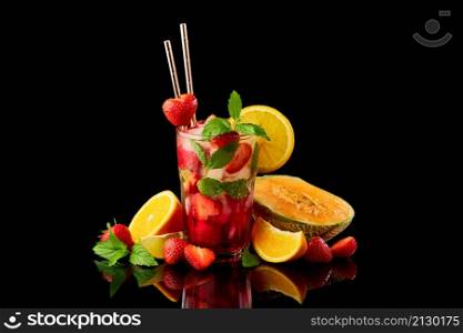 Strawberry mojito with lemon and mint isolated on black background with reflection.. Strawberry mojito with lemon and mint isolated on black background with reflection