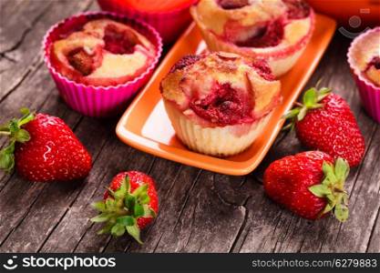 Strawberry muffins on the plate and berries