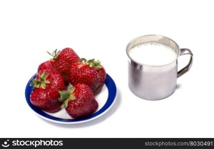 strawberry on a saucer and a milk mug, isolate a berry subject