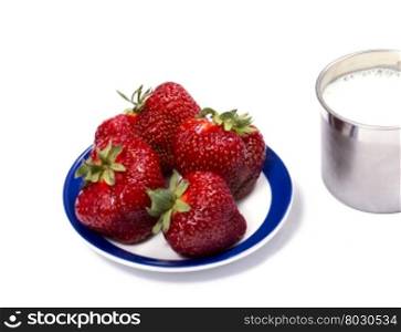 strawberry on a saucer and a steel mug of milk, a berry subject