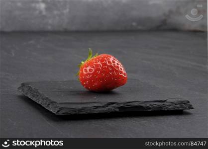 Strawberry on gray shale