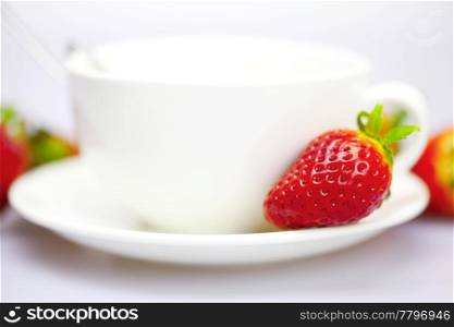 Strawberry on the cup and saucer