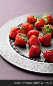 strawberry on vintage plate