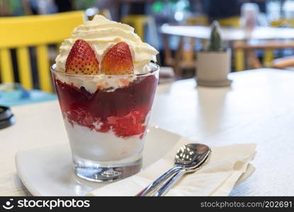 Strawberry Parfait, Healthy layered dessert with cream, muesli and fresh strawberry sauce 