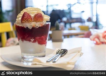 Strawberry Parfait, Healthy layered dessert with cream, muesli and fresh strawberry sauce