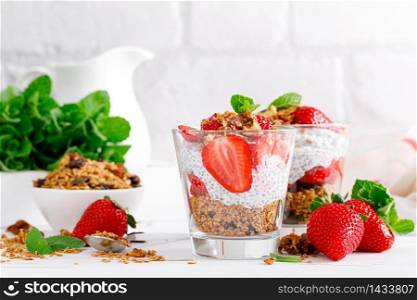 Strawberry parfait with yogurt, homemade granola and fresh berries