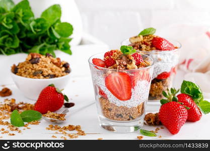 Strawberry parfait with yogurt, homemade granola and fresh berries