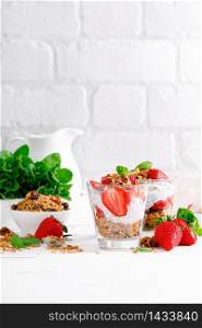 Strawberry parfait with yogurt, homemade granola and fresh berries