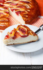 Strawberry pie piece on cake server