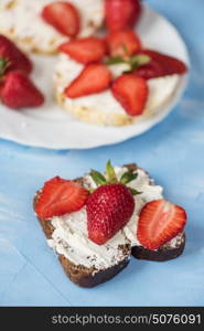 Strawberry sandwiches with mascarpone. Strawberry sandwiches with mascarpone on blue background