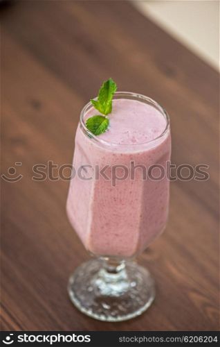 Strawberry smoothie on table. Strawberry smoothie on the table
