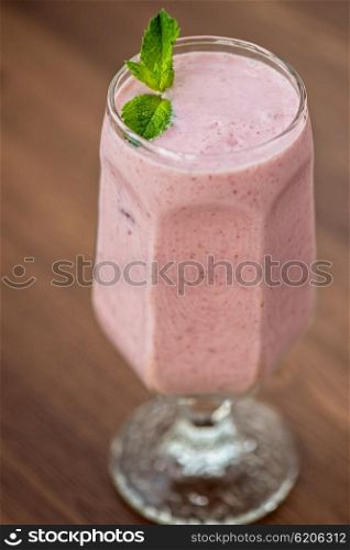 Strawberry smoothie on table. Strawberry smoothie on the table