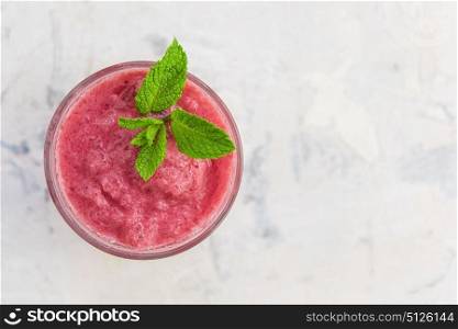 Strawberry smoothie with mint. Strawberry smoothie with mint on a white concrete background