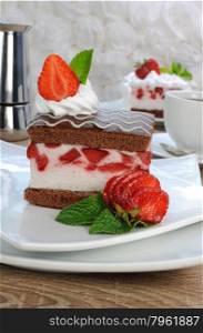 Strawberry souffle on a chocolate sponge cake