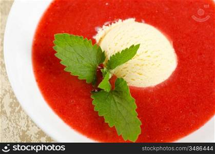 Strawberry soup with ice cream and mint