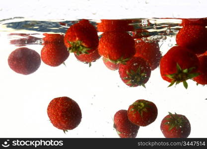 strawberry splash in water isolated on white background