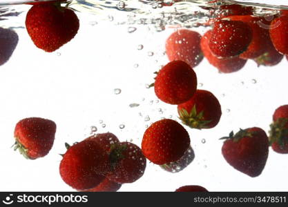 strawberry splash in water isolated on white background