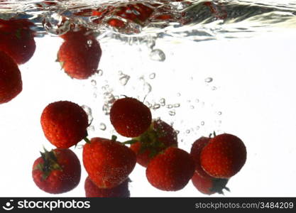 strawberry splash in water isolated on white background